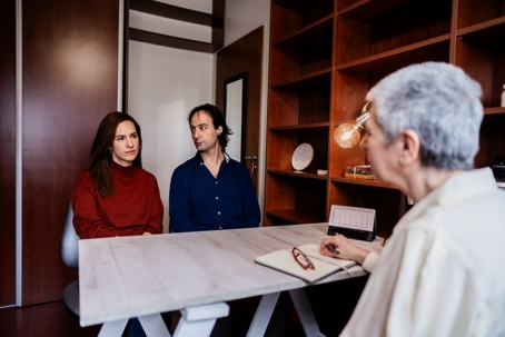 couple talking with a lawyer